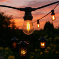 Guirnalda LED exterior E27 - 50 m con 100 bombillas y luz cálida de 2200 K - Cable plano negro IP65 conectable y regulable - 230 V para jardín terraza y eventos